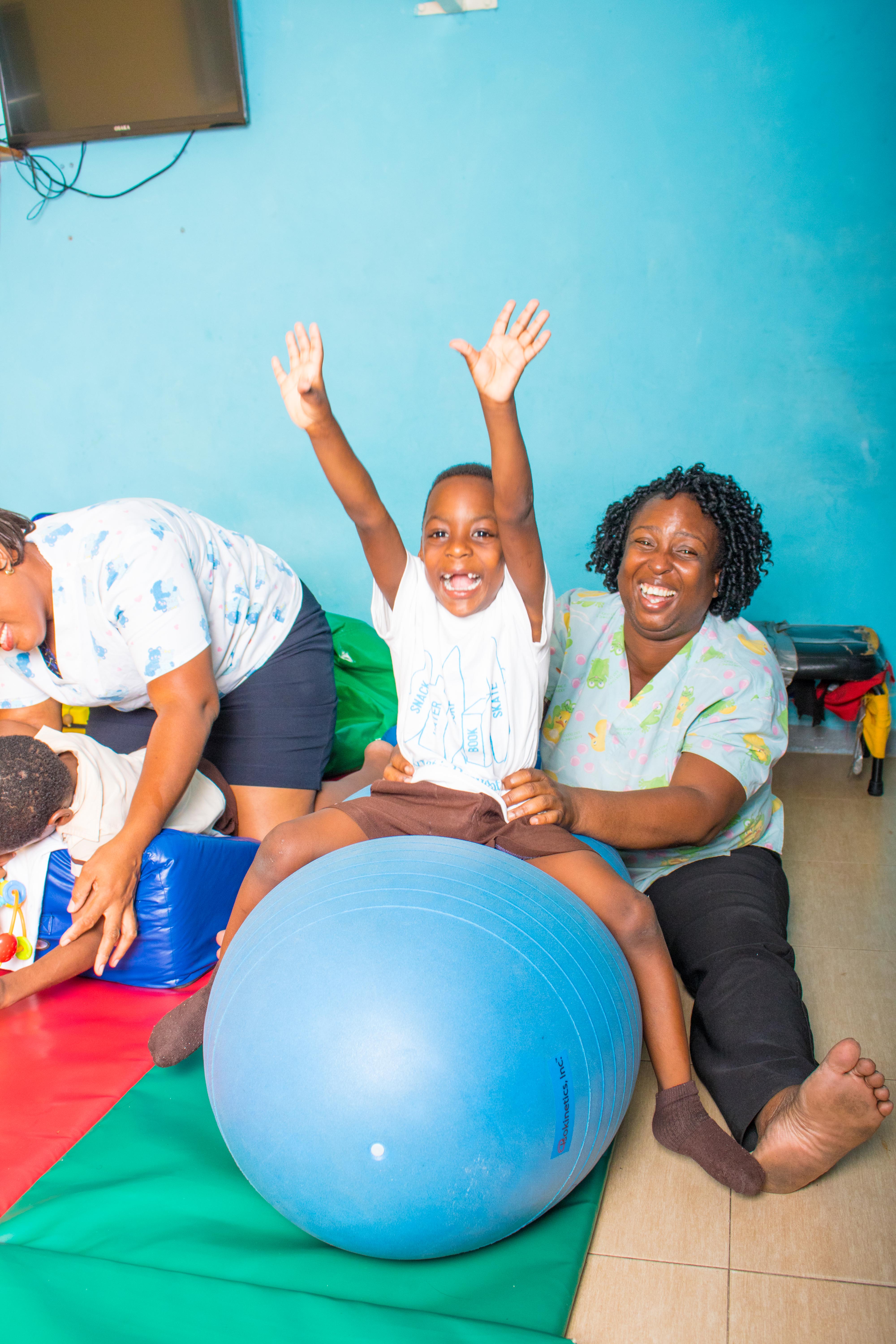 Social Worker and student at the Stimulation Plus facility in Kingston beaming with joy