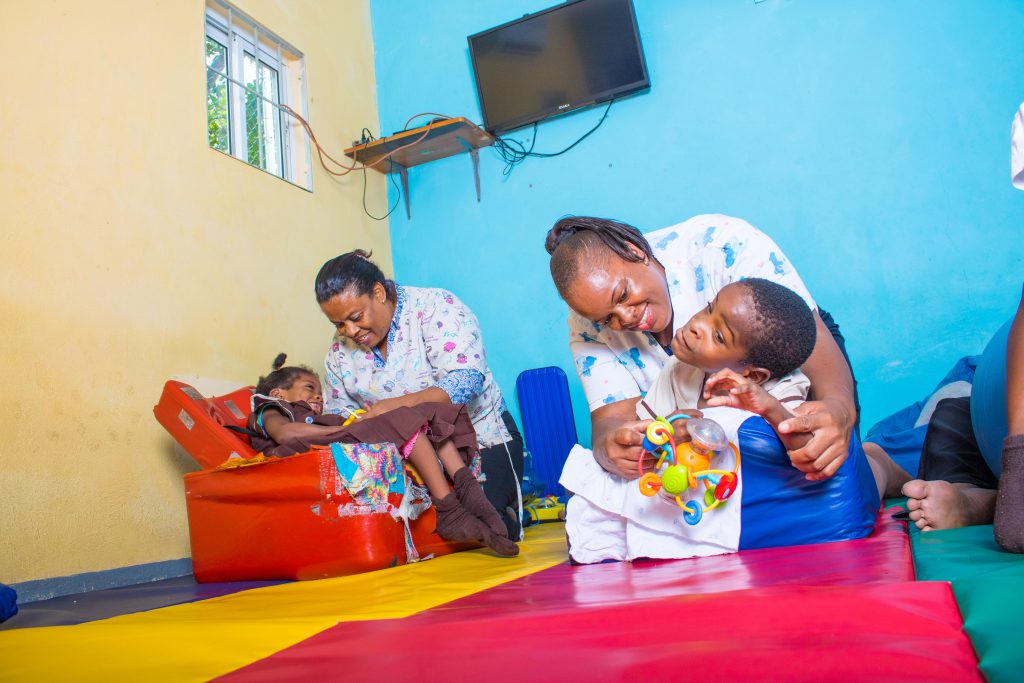 Social Workers at the Stimulation Plus aiding the development of children with disabilities
